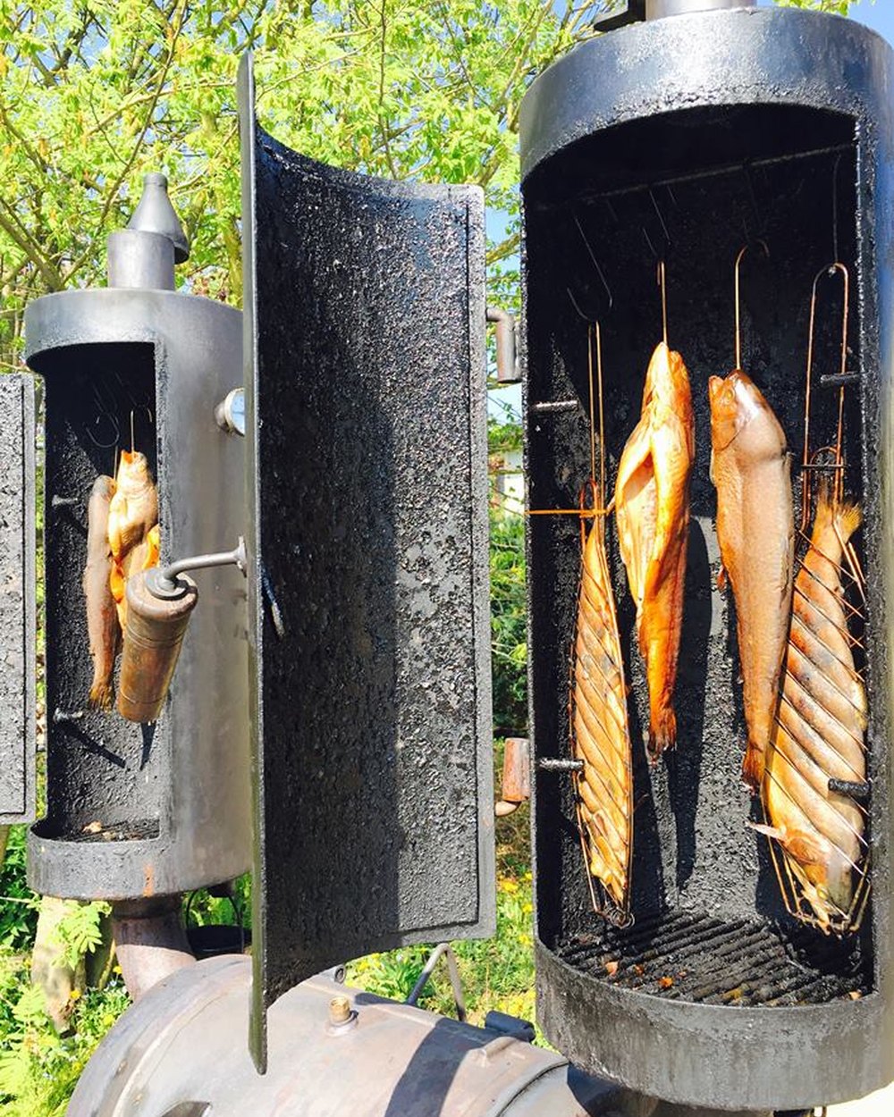 Outdoor smokers with freshly smoked fish at Plankton Restaurant